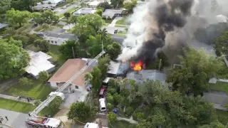 NOTICE SMOKE? Strong winds and clutter posed challenges in Fort Myers house fire.